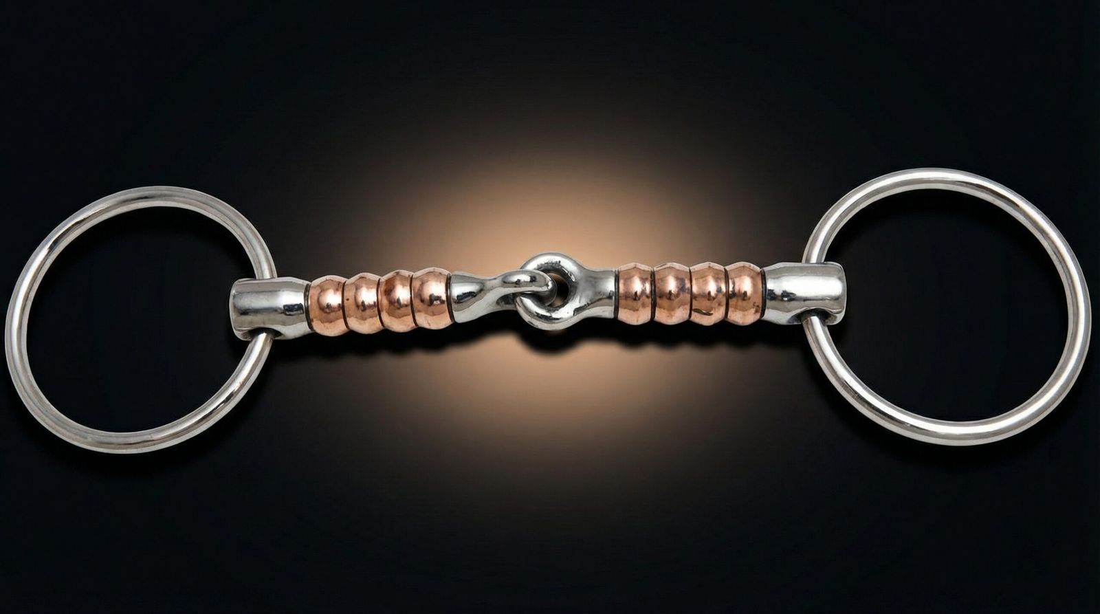 A professional brass roller bit featuring high-grade stainless steel loose rings and a single-jointed mouthpiece with integrated brass rollers.