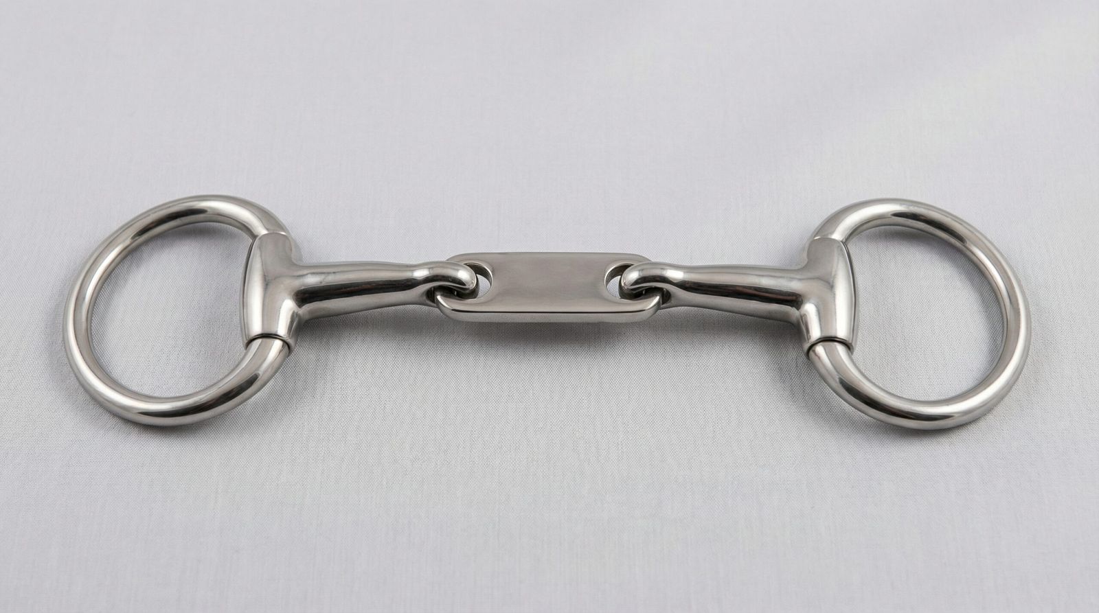 A professional Control Plate Snaffle featuring an eggbutt-style cheek and a central flat control plate for ergonomic tongue pressure.