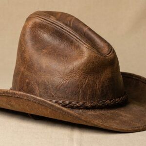 A premium brown Gus Leather Hat with a sloped crown and braided band.