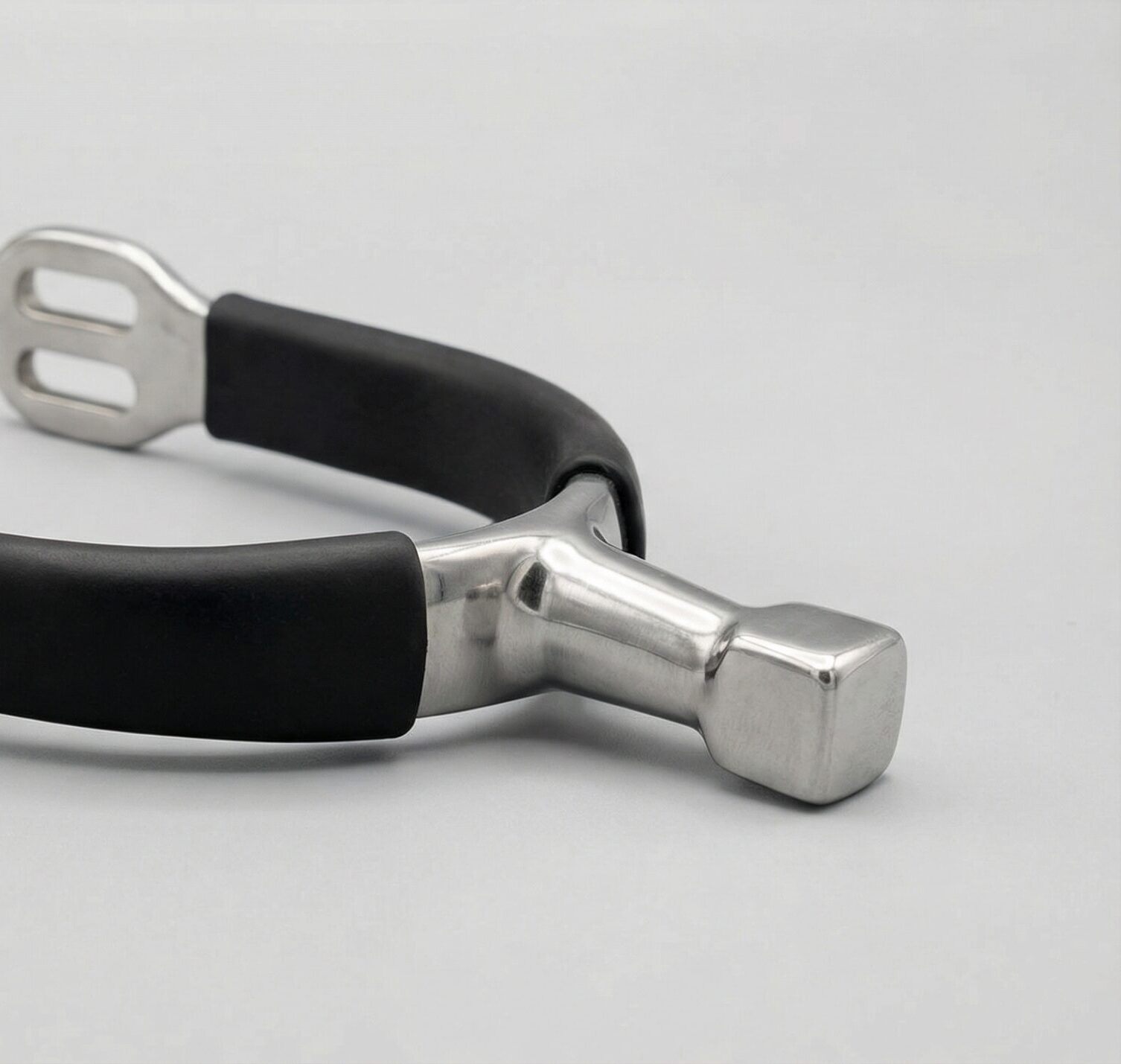 A professional hammerhead horse spur featuring a blunt square neck and a durable stainless steel core.