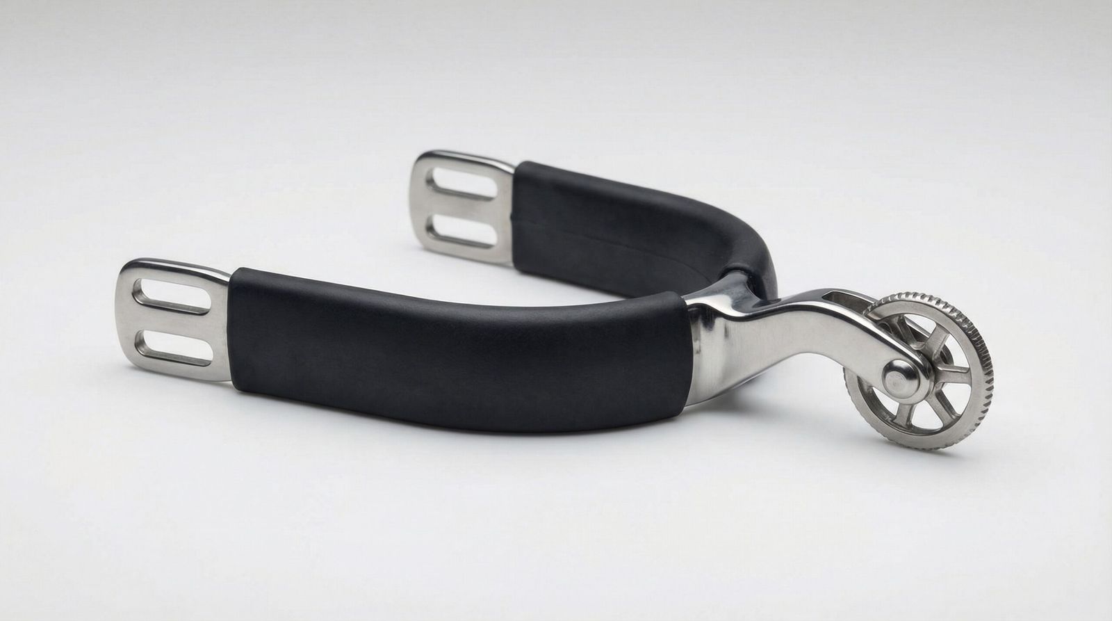 A professional stainless rowel spur featuring a rotating wheel and a black rubberized heel band.